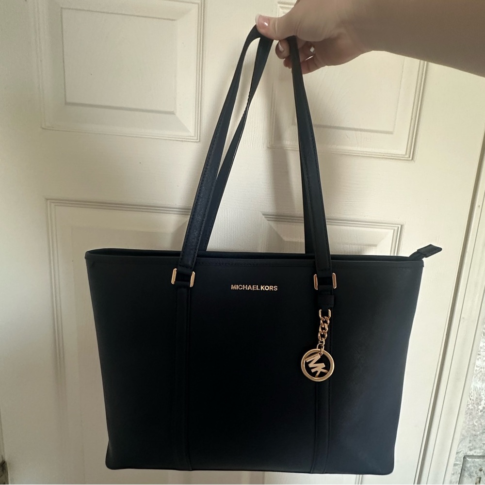 Michael Kors Navy Purse with Gold Charm-like new condition